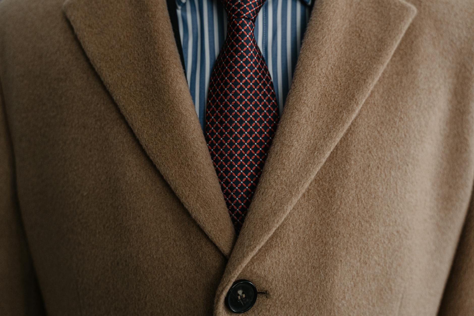 man in brown suit jacket