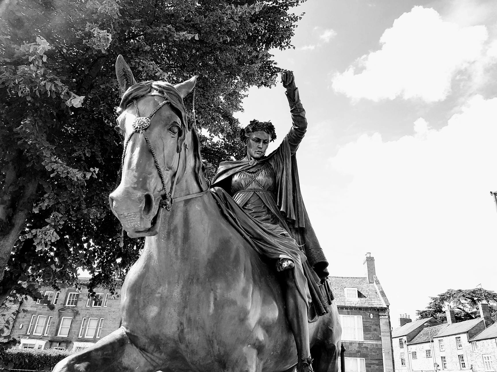 woman riding horse statue