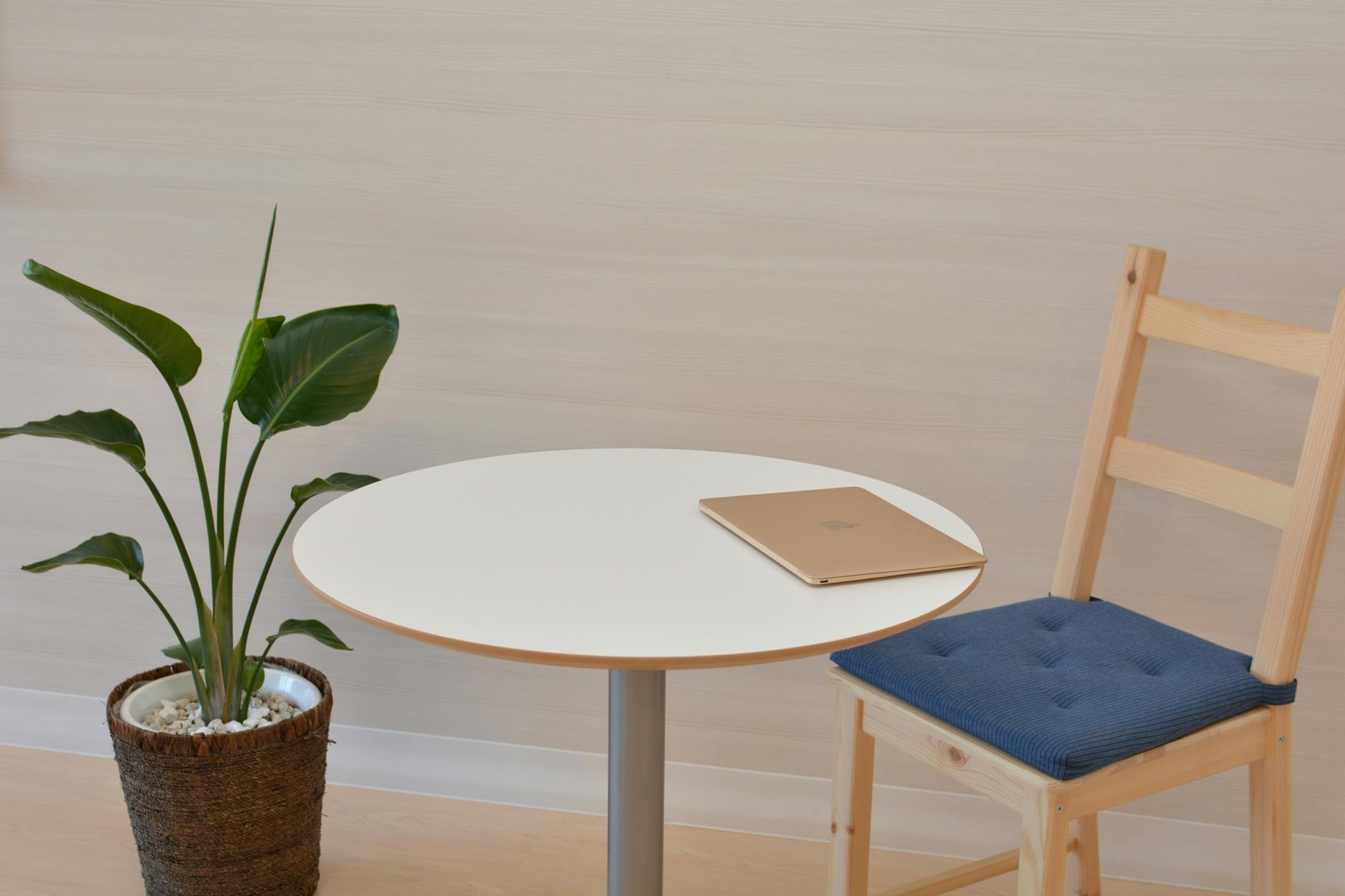 macbook on pedestal table