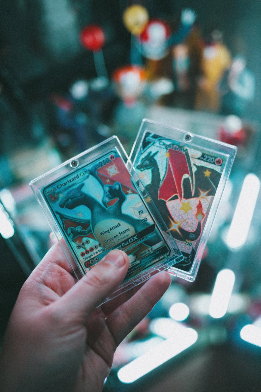 a person holding a pokemon trading card