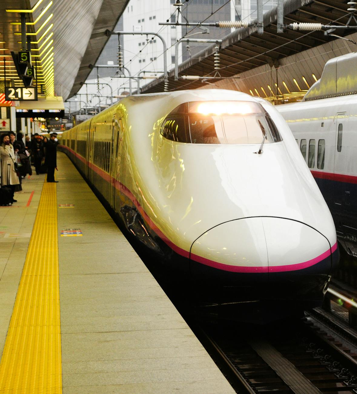 sleek bullet train arriving at station platform