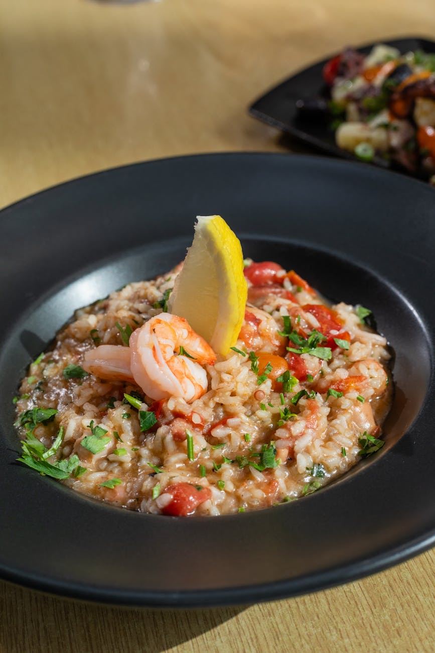 delicious shrimp risotto with lemon garnish