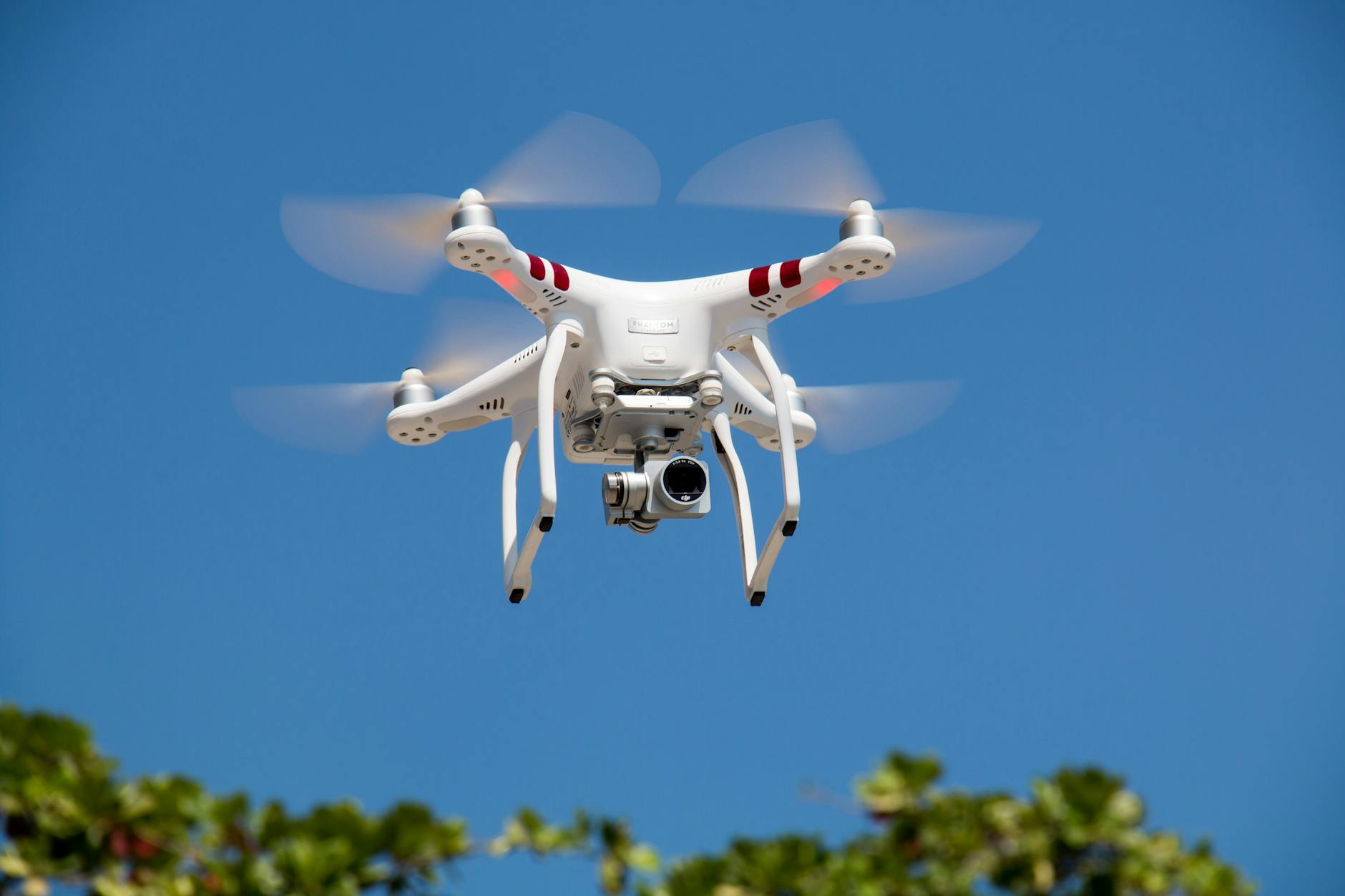 drone flying against blue sky